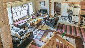 A cozy cabin interior with a living room, a fireplace, and a dining area. - Ruuhikari by Interhome (Ulvila)