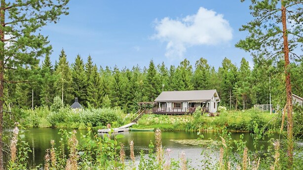 A rustic cabin by a lake surrounded by dense forest. - Ruuhikari by Interhome (Ulvila)