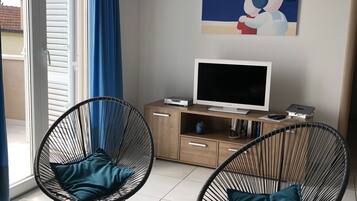 Premium Apartment, Partial Sea View | Living area | 88-cm flat-screen TV with satellite channels, TV, DVD player