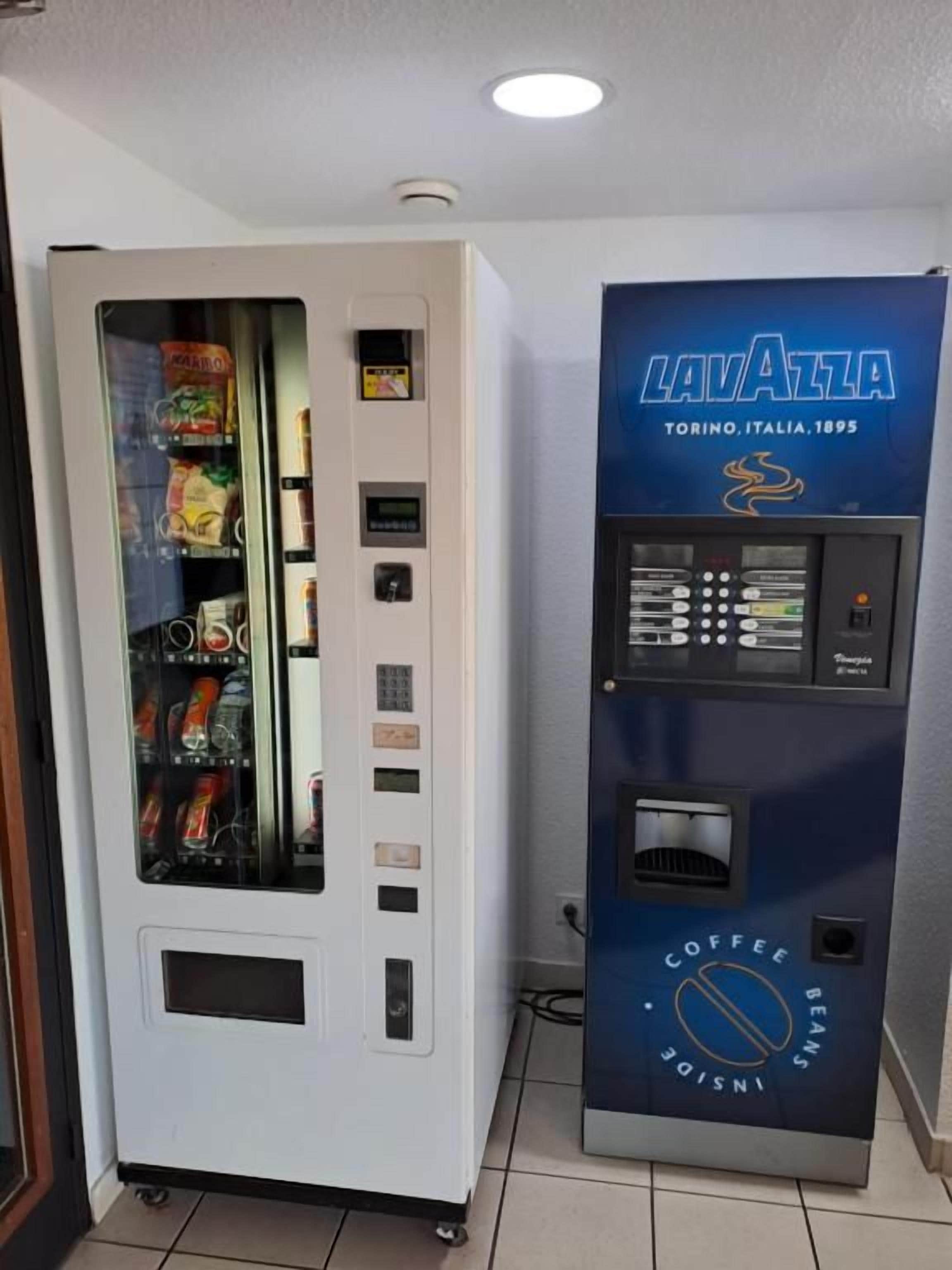 A vending machine with a coffee and bean dispenser, and a separate section for snacks.