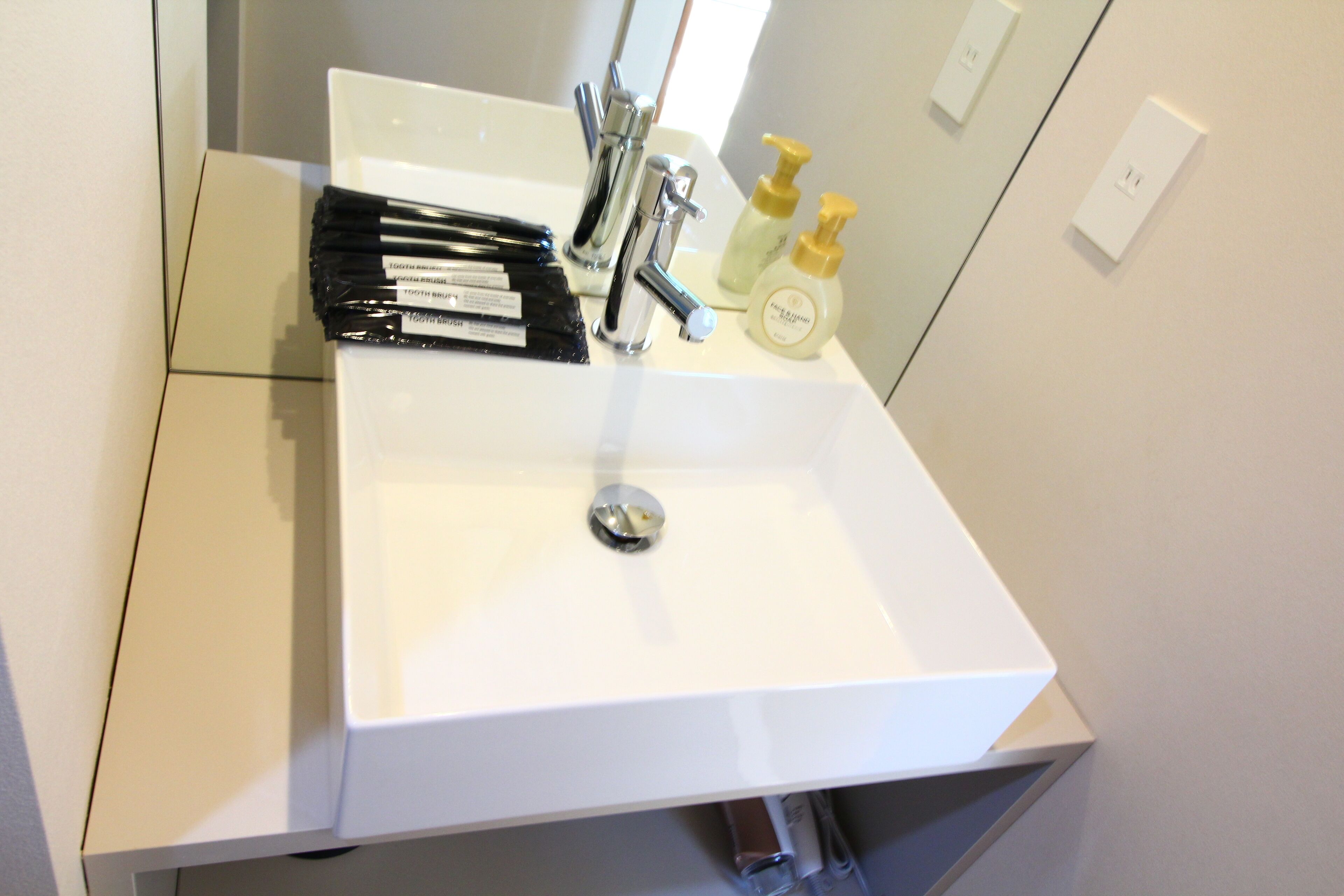 executive family suite | bathroom | free toiletries, hair dryer, slippers, electronic bidet