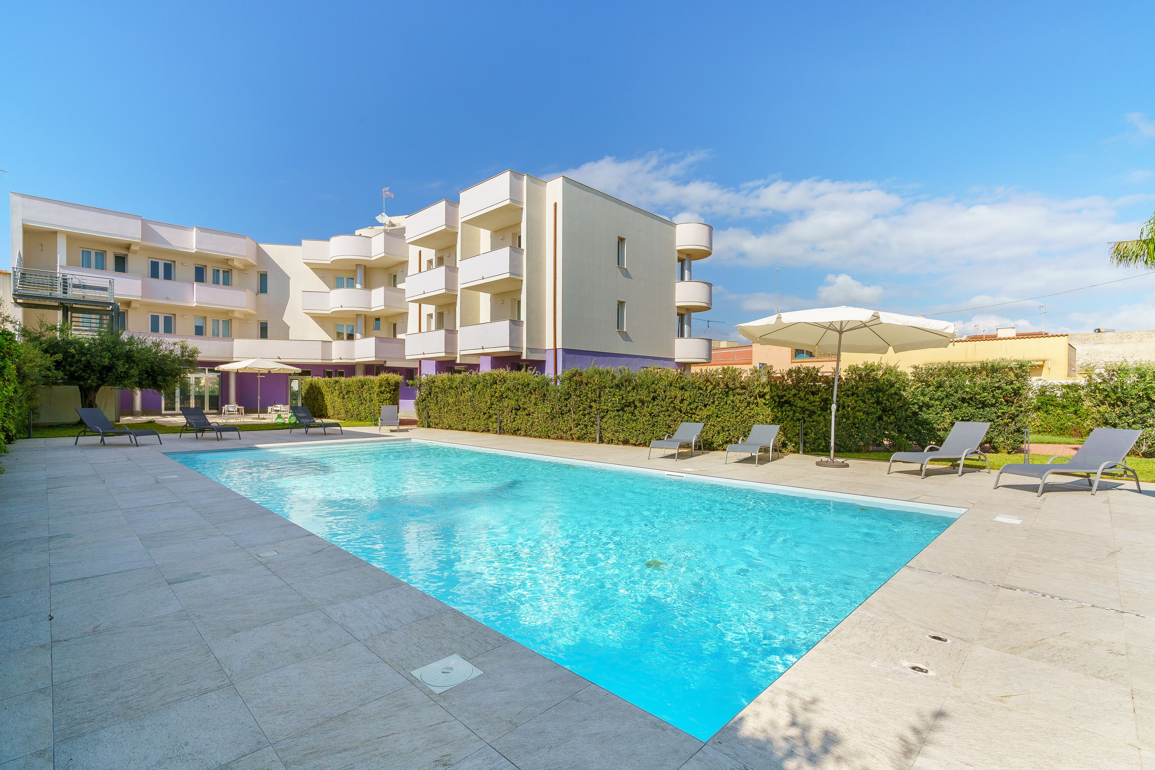 Seasonal outdoor pool, open 9:00 AM to 7:00 PM, sun loungers