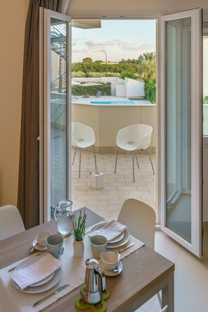 Deluxe Apartment, Kitchenette, Pool View | Living area | 40-inch flat-screen TV with digital channels, TV - Travini Hotel Residence (Marsala)