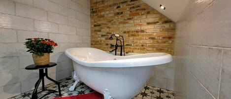 Bathtub, hair dryer, towels, soap