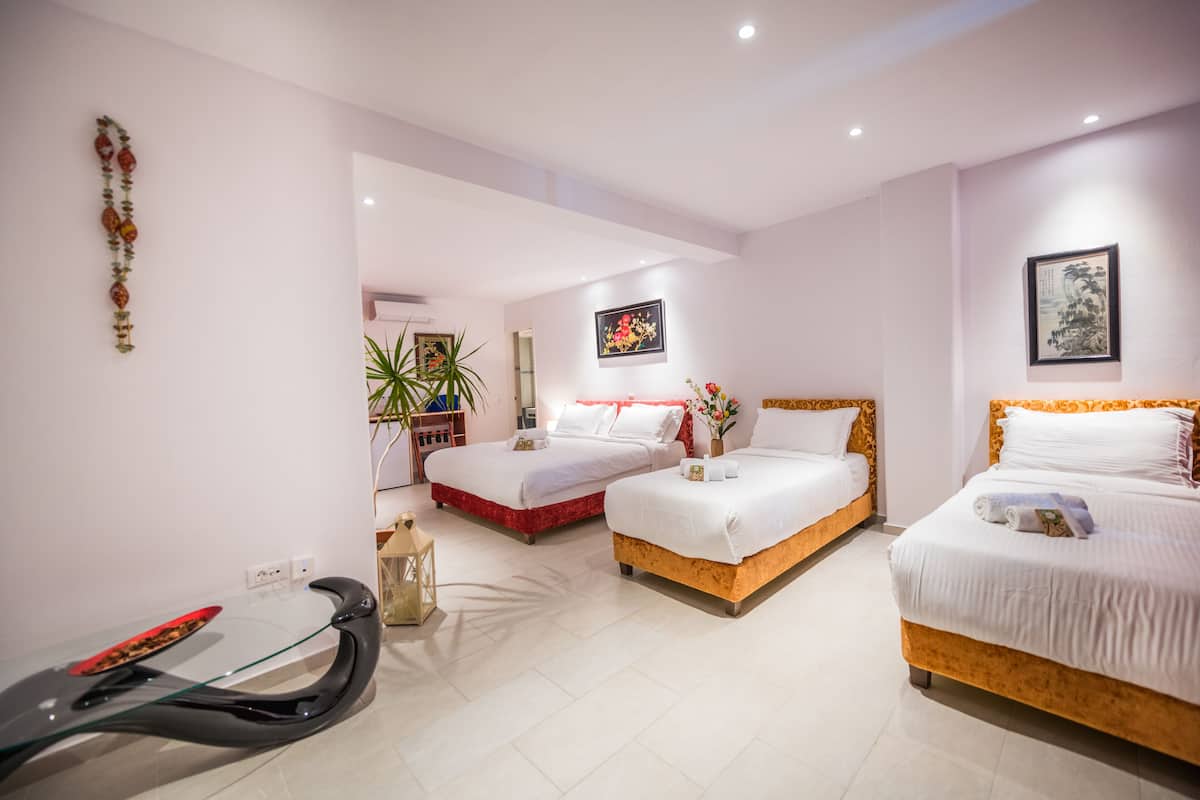 Family Suite, Patio, Pool View | 1 bedroom, minibar, in-room safe, individually decorated