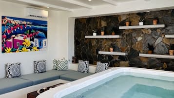 Design House, Patio, Pool View | Living area | 28-inch flat-screen TV with satellite channels, TV