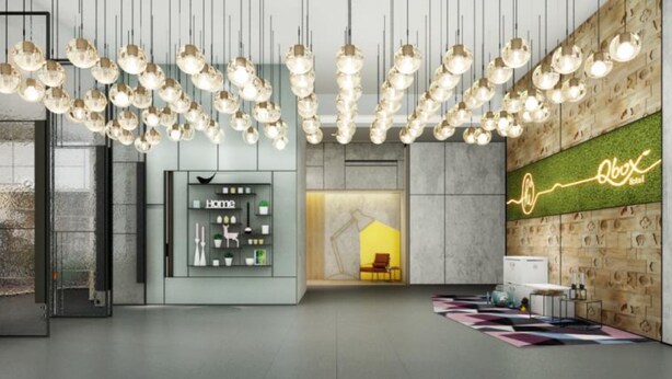 A modern hotel lobby with a central seating area, a neon sign, and a wall-mounted display. - Q-Box Hotel Shanghai Nanqiao (Shanghai)