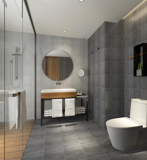 A modern bathroom with a glass shower enclosure, a wooden vanity, a round mirror, and a toilet. - Q-Box Hotel Shanghai Nanqiao (Shanghai)