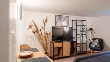 Studio, 1 Double Bed, Garden View | Living area | Flat-screen TV
