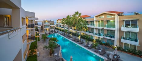 2 outdoor pools, open 9:00 AM to 7:30 PM, pool umbrellas, pool loungers