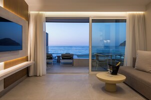 Beachcomber Suite - Beachfront with Private Pool | Living area | 42-inch LCD TV with satellite channels, TV