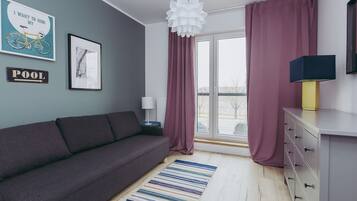 Apartment, Courtyard View | Living area | Flat-screen TV