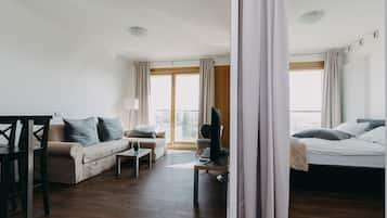 Exclusive Apartment, City View | Premium bedding, laptop workspace, blackout drapes, iron/ironing board
