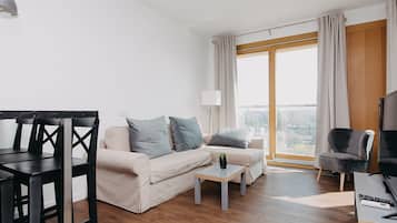 Exclusive Apartment, City View | Living room | Flat-screen TV
