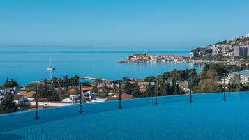 Seasonal outdoor pool, pool umbrellas, sun loungers