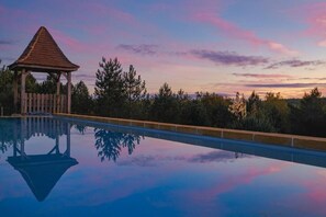 Seasonal outdoor pool, open 8:30 AM to 9:00 PM, pool umbrellas