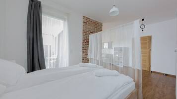 Comfort Apartment, Courtyard View | Premium bedding, laptop workspace, iron/ironing board, free WiFi