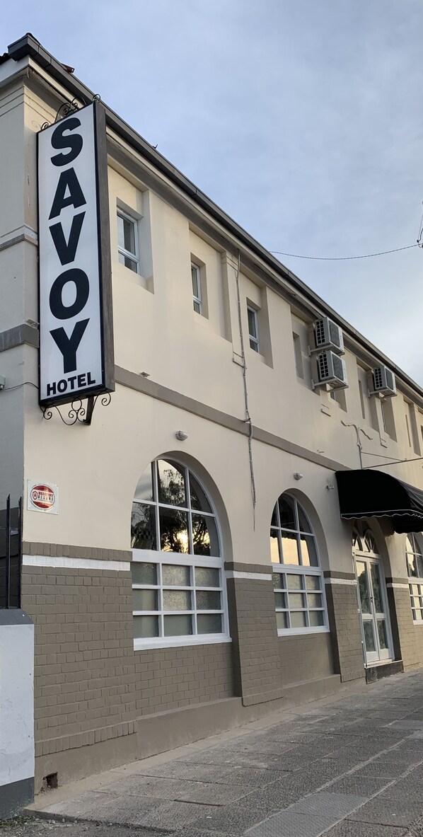 A building with a sign reading "SAVOY HOTEL" and arched windows. - Savoy Hotel Beaufort-West (Beaufort West)
