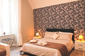 Premium bedding, down duvets, desk, laptop workspace