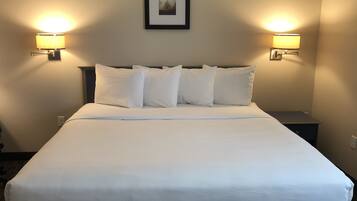 Cortinas blackout, tabla de planchar con plancha y cuna de viaje