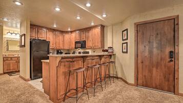 Fridge, microwave, stovetop, coffee/tea maker