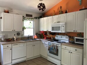 Microwave, dishwasher, coffee/tea maker, cookware/dishes/utensils