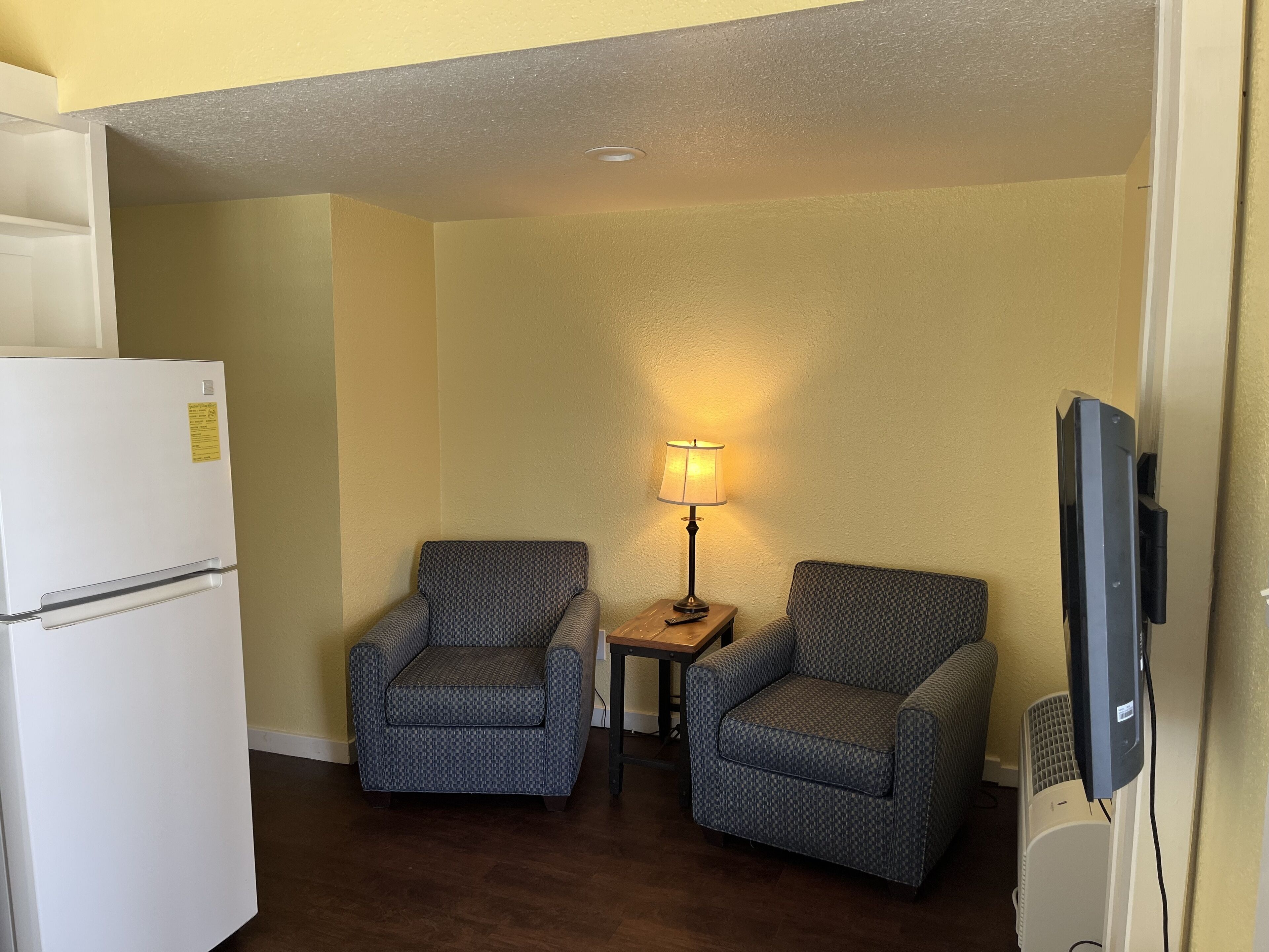 senior suite, 2 queen beds | living area | 45-inch tv with cable channels