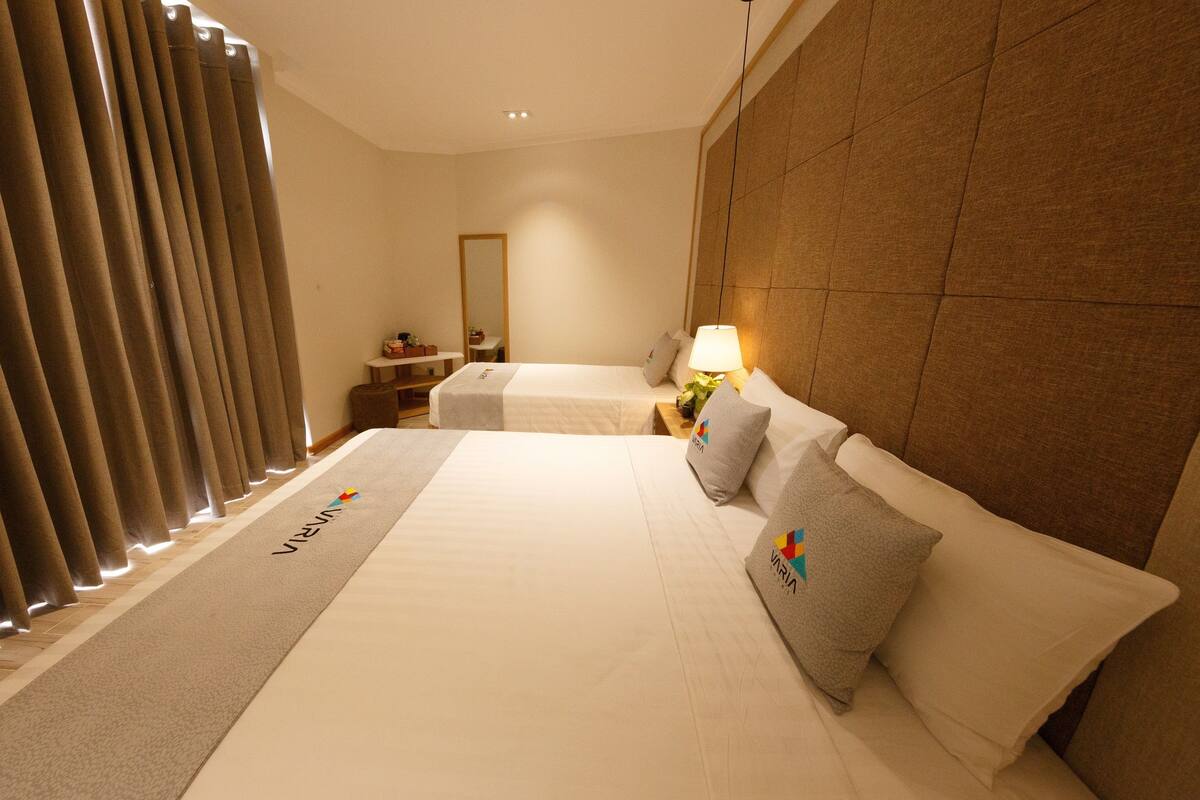 Deluxe Triple Room, Multiple Beds | Minibar, in-room safe, desk, blackout curtains