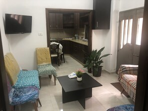 Lägenhet Deluxe | Vardagsrum | Platt-tv