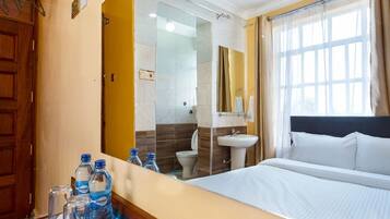 Premium bedding, memory-foam beds, desk, laptop workspace