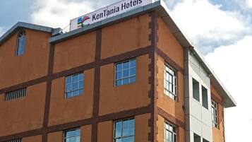A multi-story hotel building with a sign reading 'KenTania Hotels.'