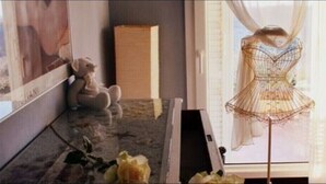 A room with a mannequin in a dress, a teddy bear, and a large window. - Enjoy breathtaking view and sunsets from the Swimming pool - Casa Magnolia LUNA (MORRONA, TERRICCIOLA)