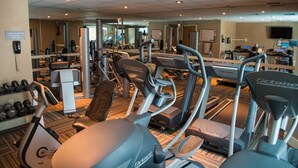 A gym with various exercise equipment including treadmills and elliptical machines. - Great Value! Cozy & Rustic Studio in Crested Butte (Crested Butte)