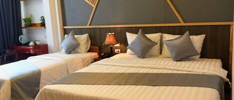 Deluxe Triple Room, City View | Hypo-allergenic bedding, down comforters, minibar