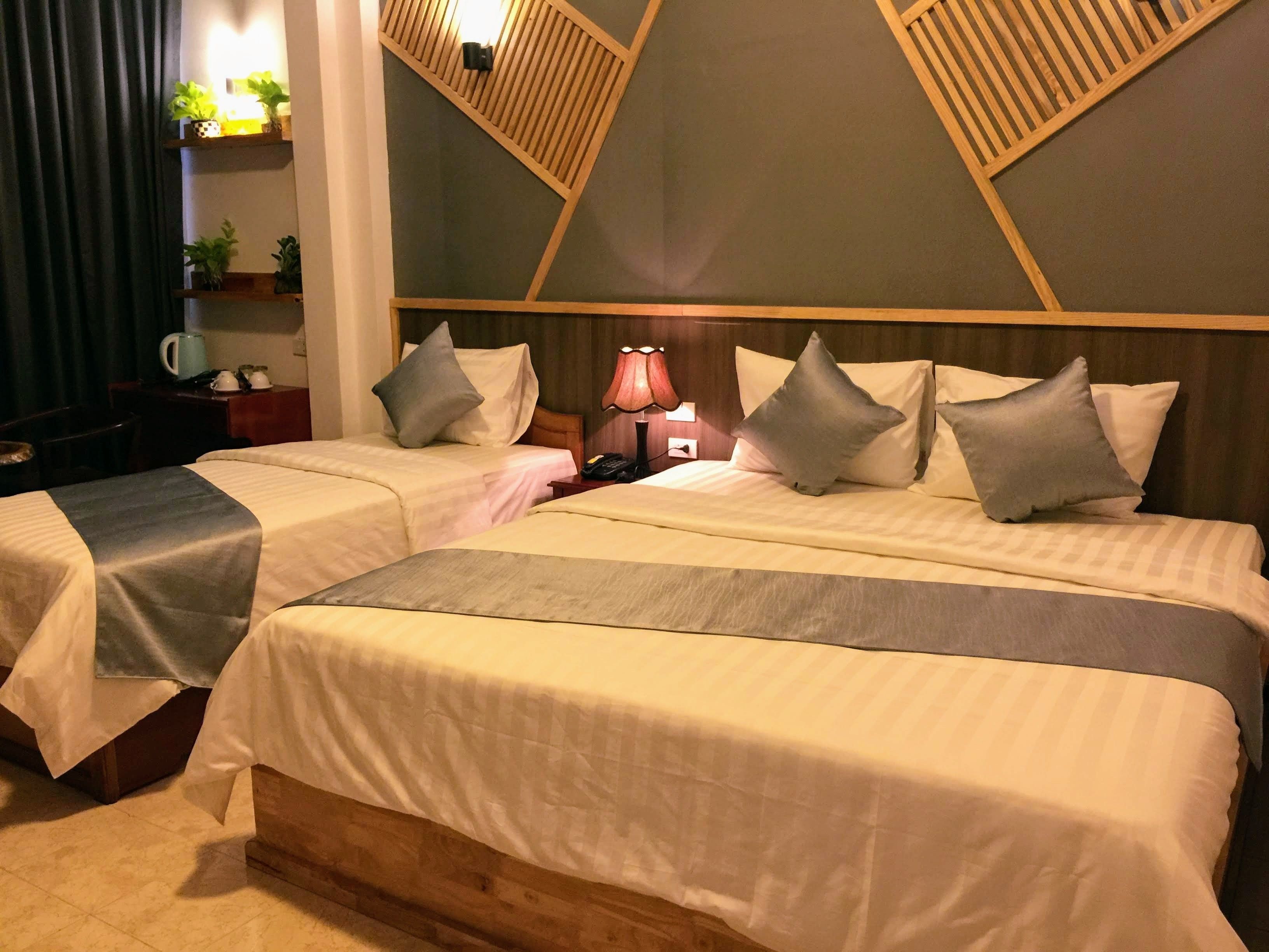 deluxe triple room, city view | living area | flat-screen tv