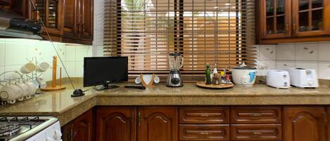 Fridge, microwave, stovetop, coffee/tea maker