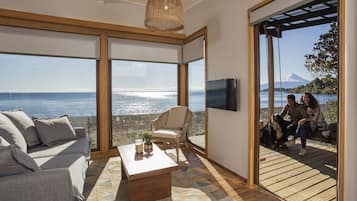 Deluxe Cabin, 2 Bedrooms, Beachfront | Living area | Smart TV, Netflix