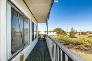A covered balcony with a view of a road and greenery. - The Cray Pot-Conveniently located in the heart of Lancelin (Lancelin)