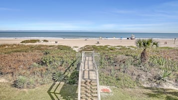 On the beach, sun loungers, beach towels