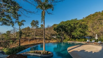 Outdoor pool, pool umbrellas, sun loungers