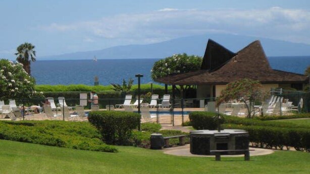 A resort with a pool, lounge chairs, and a view of the ocean. - Beachfront//Oceanfront//Ocean View - 1/2/3 Bedroom Kihei Condo (Kihei)