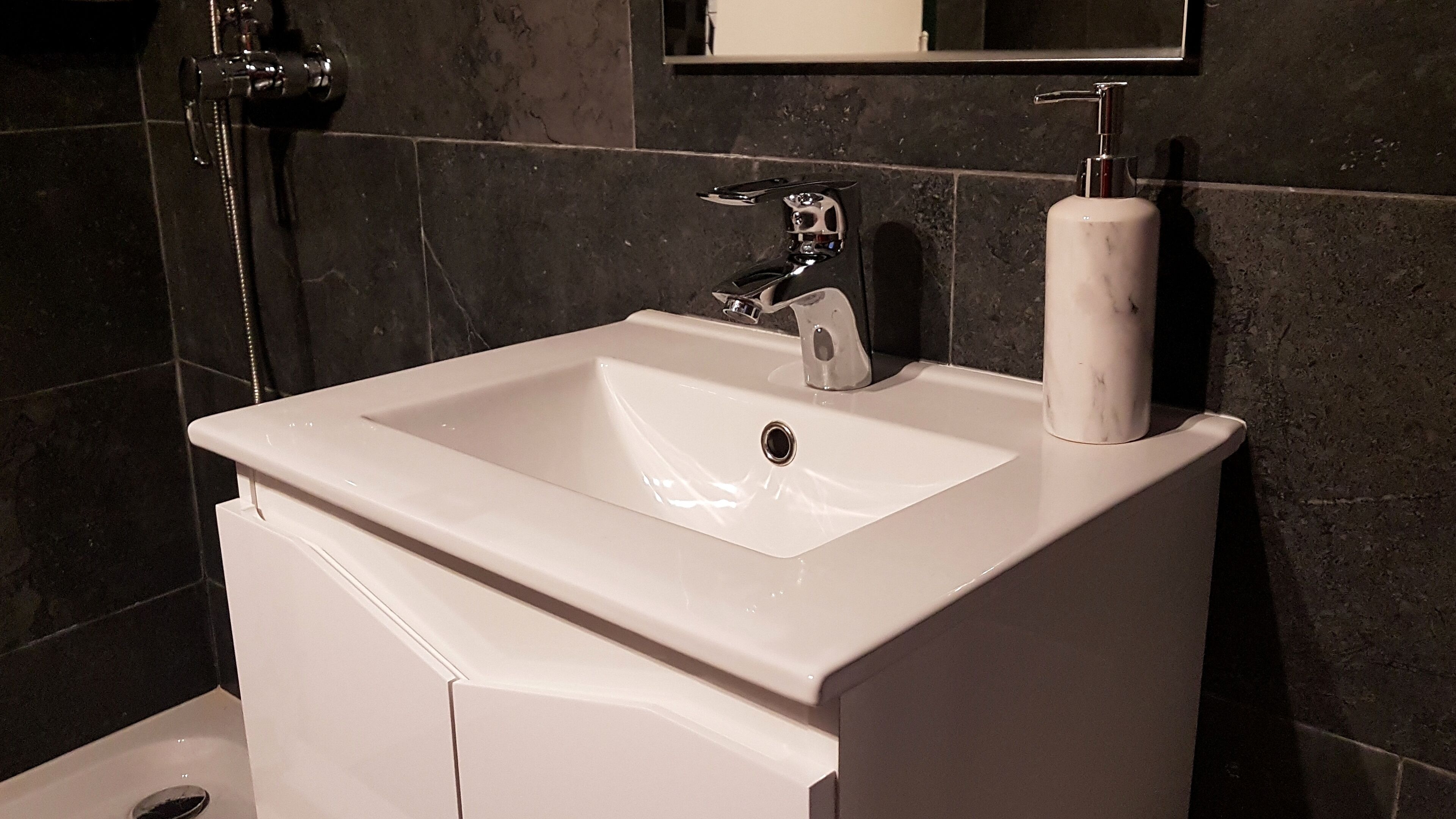 Shower, hair dryer, towels, shampoo