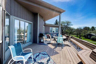 Bright and airy home with sunset views less than a mile to the lake and village