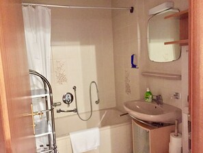 Bathtub, hair dryer, towels