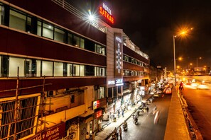 A multi-story building with a prominent "HOTEL SATKAR" sign, indicating a hotel establishment. - Hotel Sheetal Plaza (Surat)