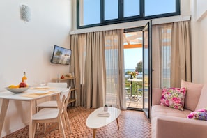 Deluxe Apartment, 1 Bedroom, Sea View (Corali) | Living room | Smart TV - Naftilos Residences I (Samos)