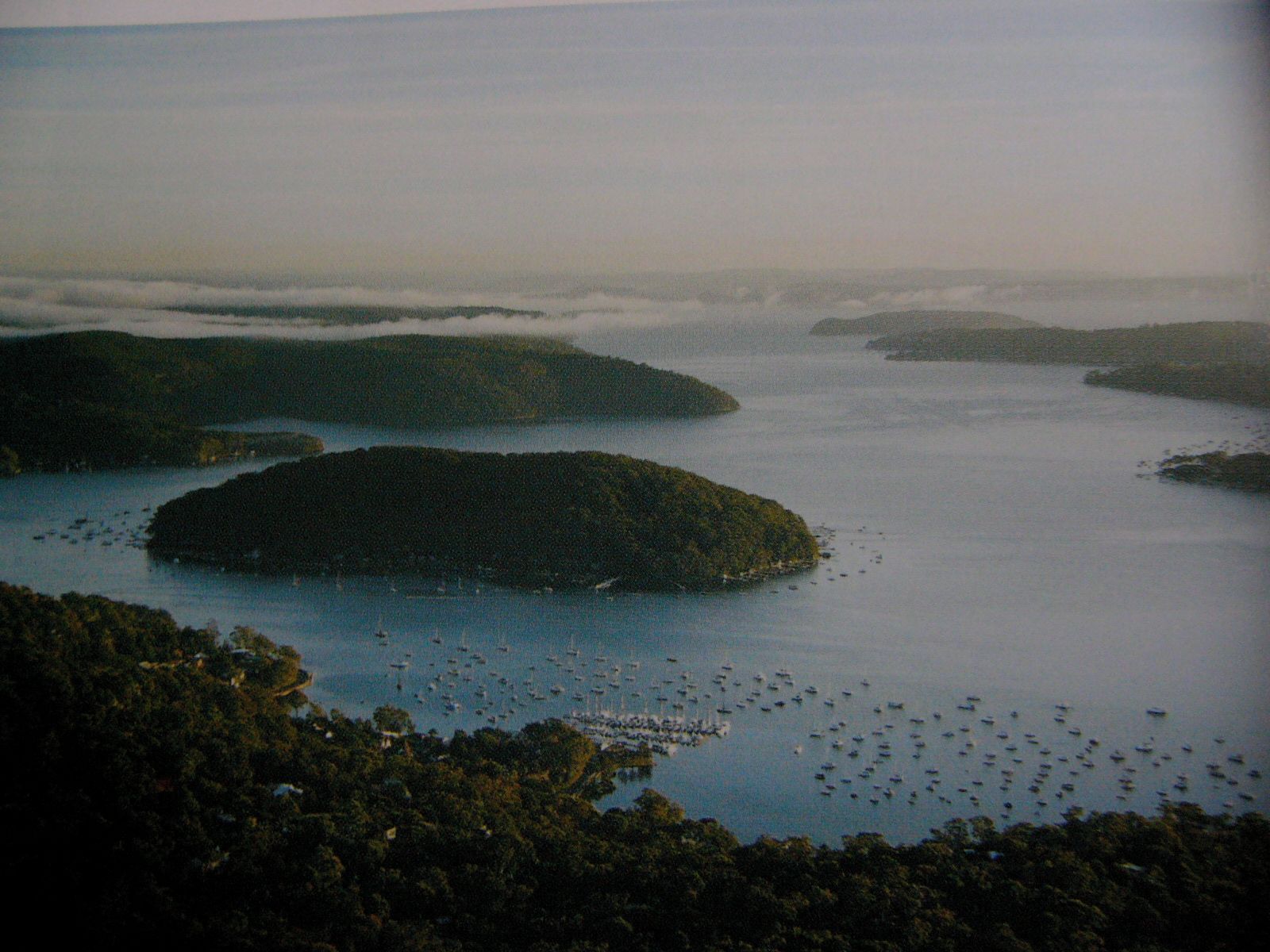 A coastal landscape with multiple islands surrounded by water.