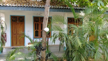 Habitación triple Deluxe, vista al jardín | Insonorización