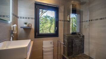Bathtub, hair dryer, towels, soap