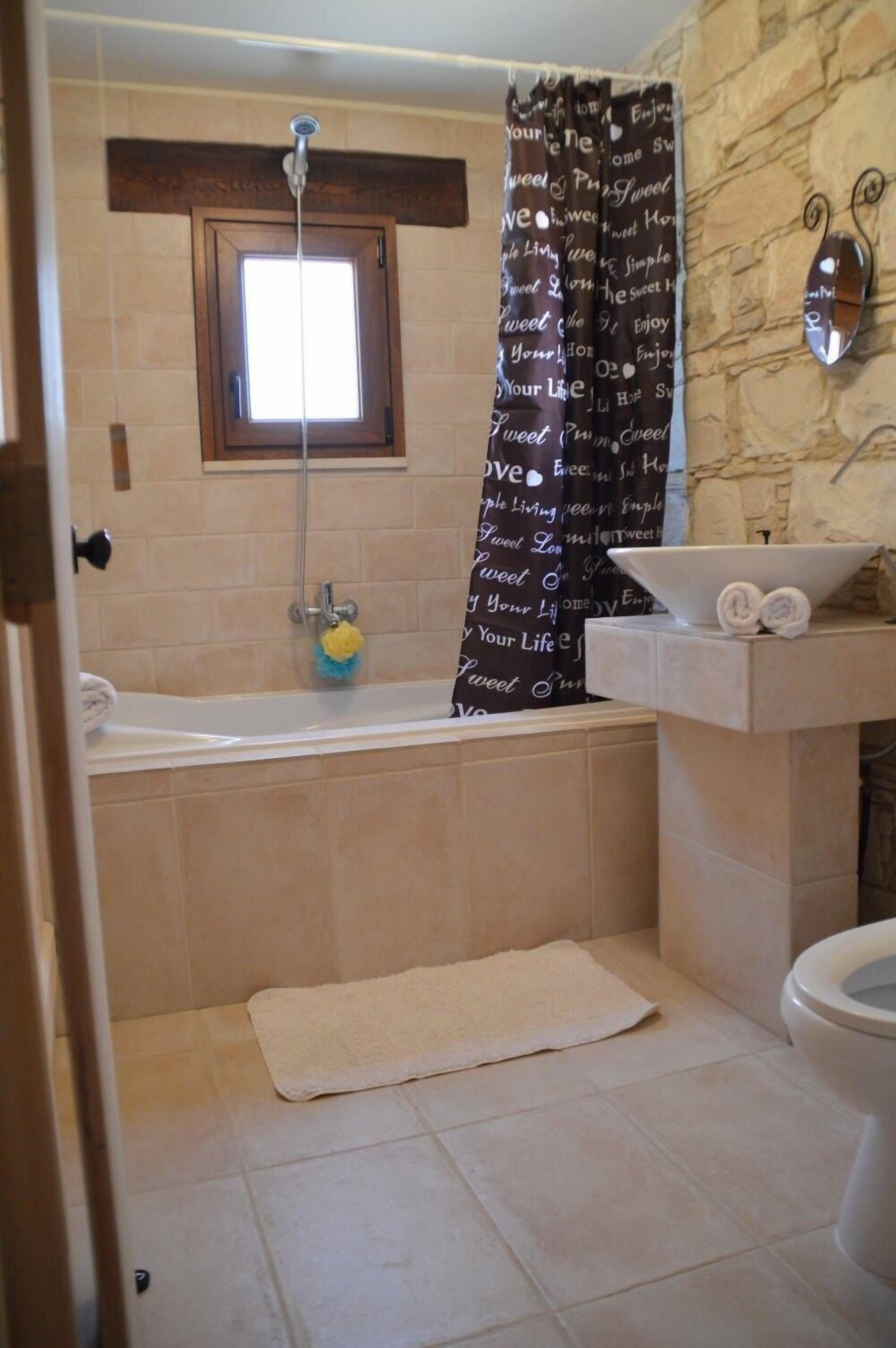 Combined shower/tub, hair dryer, towels, soap